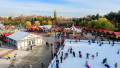 Bucharest, Romania, 30 November 2023: Vivid colorful houses and ice skate ring at West Side Christmas Market in Drumul Taberei neignbourhood, in a sun