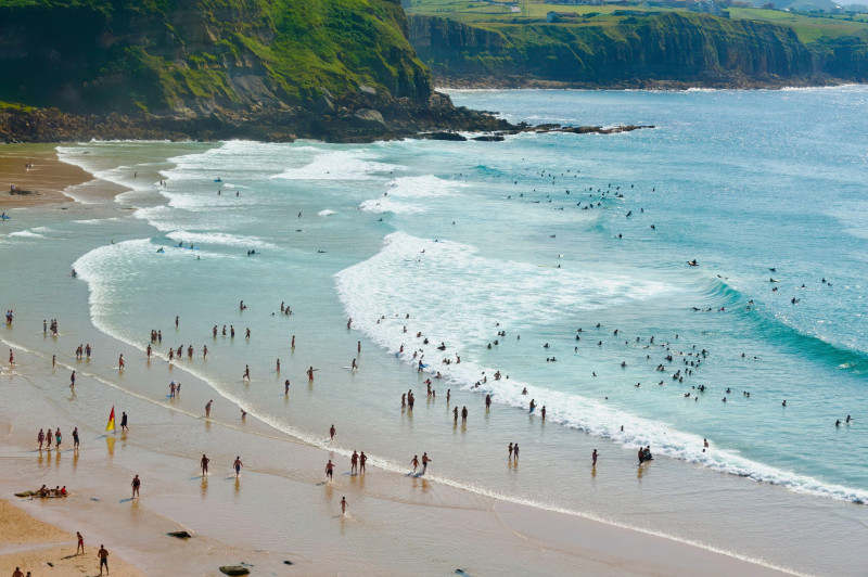 The surfers beach Playa de los Locos on a hot summer July day on the north coast of Spain Suances Cantabria Spain Europe