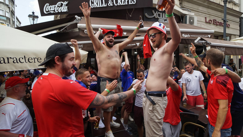 Bucharest, Romania - June 28, 2021: France and Switzerland fans party in the pubs and streets of the old town before the football match between France