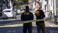 FBI agents survey the corners of Bourbon Street and Orleans Avenue, just a few blocks from where a man ramped a truck into a crowd at the edge of the French Quarter in the early morning hours of Wednesday, January 1, 2025, in New Orleans