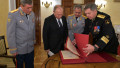 Moscow, Russia. 2 November 2018. Russian President Vladimir Putin, center, views historic papers from the GRU before a gala event to mark the centenary of the Main Directorate of the General Staff of the Armed Forces of Russia at the Russian Army Theatre