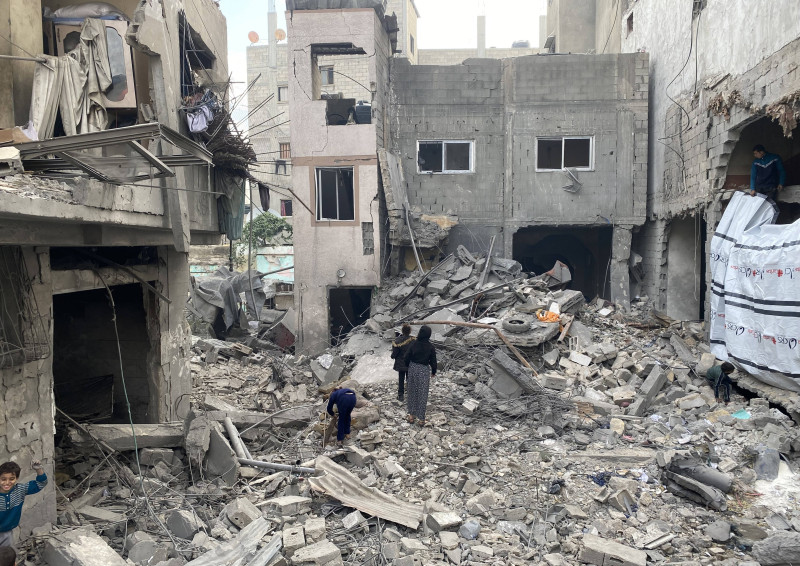 People check the rubble of buildings hit in Israeli strikes the previous night in Al Daraj neighborhood in Gaza City
