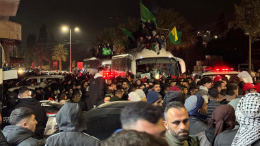 Palestinian hostages released within the hostage swap between Israel and Hamas are welcomed by hundreds in Beitunia, West Bank