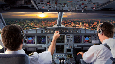 Cockpit,View,Of,Modern,Airplane,In,Flight,During,The,Sunset.