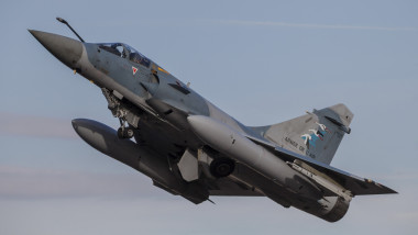 A French Air Force Mirage 2000-5 fighter jet taking off.