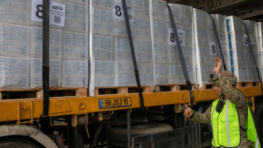 Mediterranean Sea, Israel. 21 May, 2024. A U.S. Army soldier assigned to the 7th Transportation Expeditionary Brigade, directs the transfer of humanitarian aid from the MV Roy P. Benavidez to the Roll-on Roll-off Distribution Facility of the Trident Float