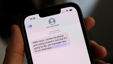 Screen shot of a text message on an iPhone sent by a scammer trying to trick the owner into texting back and passing over personal info. London, UK.