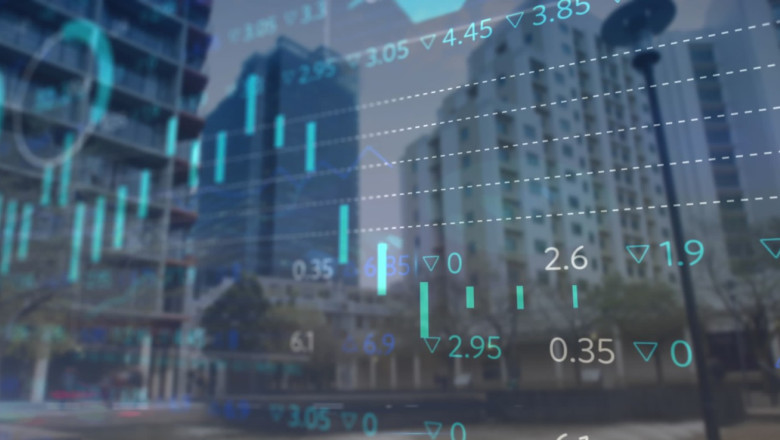 Image of statistical and stock market data processing against view of tall buildings