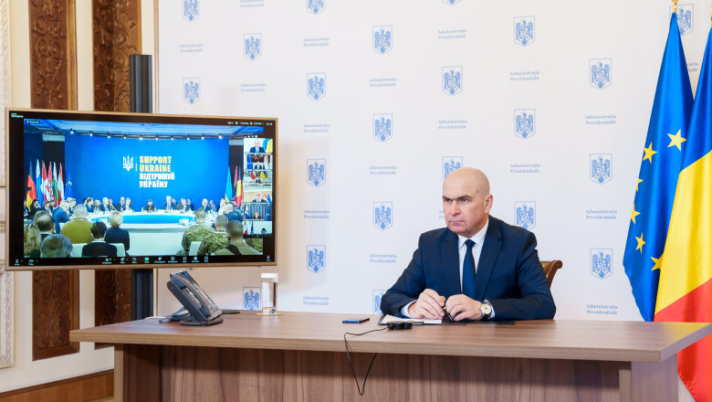 ilie bolojan la birou, videoconferinta cu kiev, ecran tv cu summitul de la kiev