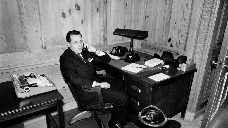 White House Secret Service agent, Clint Hill, sits at his desk in the Map Room of the White House, Washington, D.C.