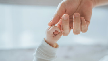 Close-up,Little,Hand,Of,Child,Baby,Holding,Hand,Of,Mother,