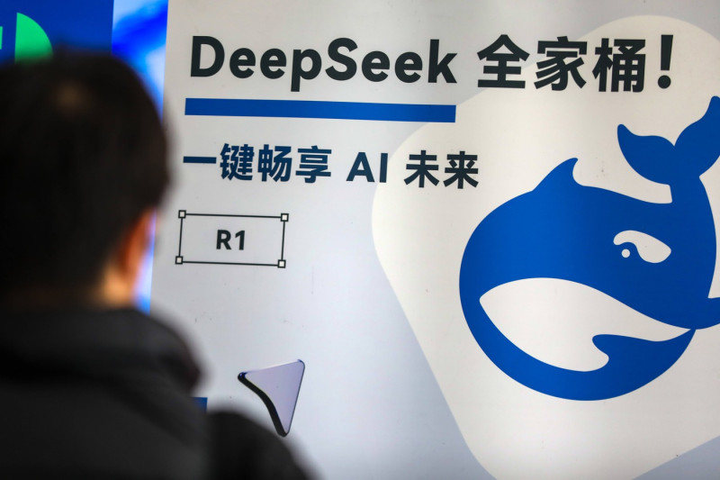 SHANGHAI, CHINA - FEBRUARY 22: A visitor watches DeepSeek poster during the 2025 Global Developer Conference on February