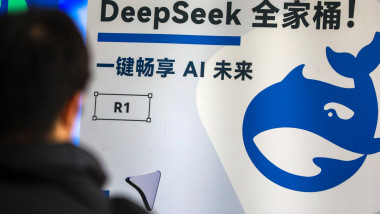 SHANGHAI, CHINA - FEBRUARY 22: A visitor watches DeepSeek poster during the 2025 Global Developer Conference on February