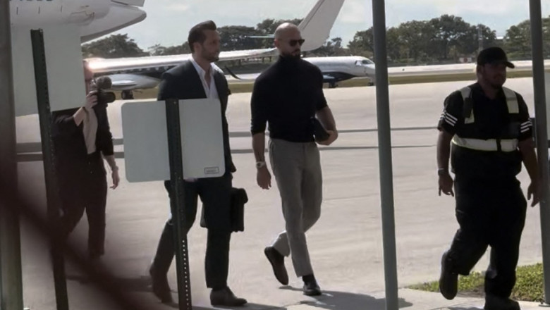 Andrew Tate and brother Tristan walk from a private jet after it landed in Florida following Romania’s decision to lift their travel restrictions. They flew in on a private jet which landed in Fort Lauderdale. Florida Governor Ron DeSantis spoke out again