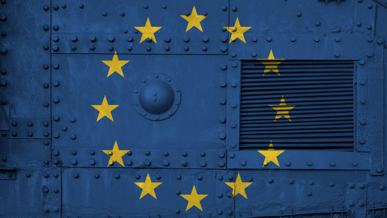 European union flag depicted on side part of military armored tank close up. Army forces conceptual background. European union flag depicted on side