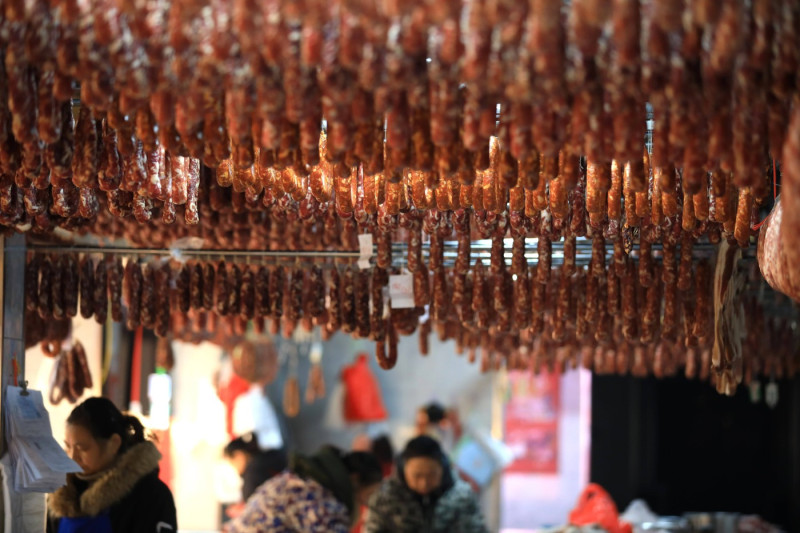 HUAIAN, CHINA - DECEMBER 21: Sausages, a meat product of winter season specialty in China, hang for sale at an agricultu