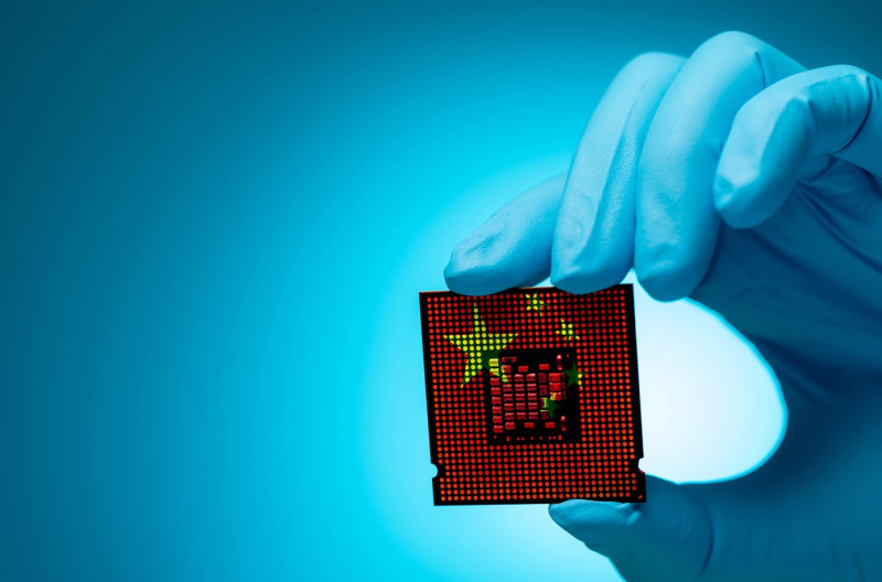 China's chip industry with electronic engineer holding computer chip. Electronic components in CPU and motherboard manufacturing sector. China role of semiconductors in the electronics industry.