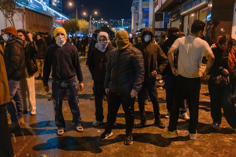 Protesters with their faces covered take part during the demonstration in support of Ekrem Imamoglu. Protesters gathered to support Ekrem ?mamo?lu and oppose his detention. The people wanted to march to the provincial building of the AK Party, the party o