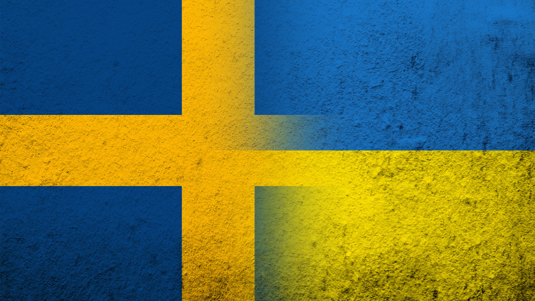 The Kingdom of Sweden national flag with National flag of Ukraine. Grunge background