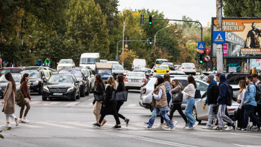People crossing the street. Bucharest, Romania, 2023
