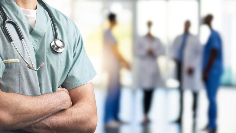 A,Close-up,Of,A,Healthcare,Professional,In,Scrubs,With,Arms