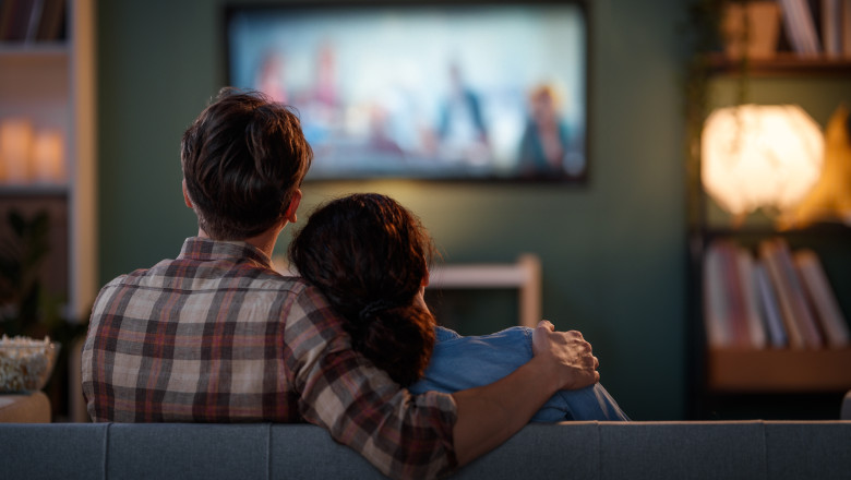 Happy,Family,Watching,Tv,,Movies,In,The,Evening,At,Home.