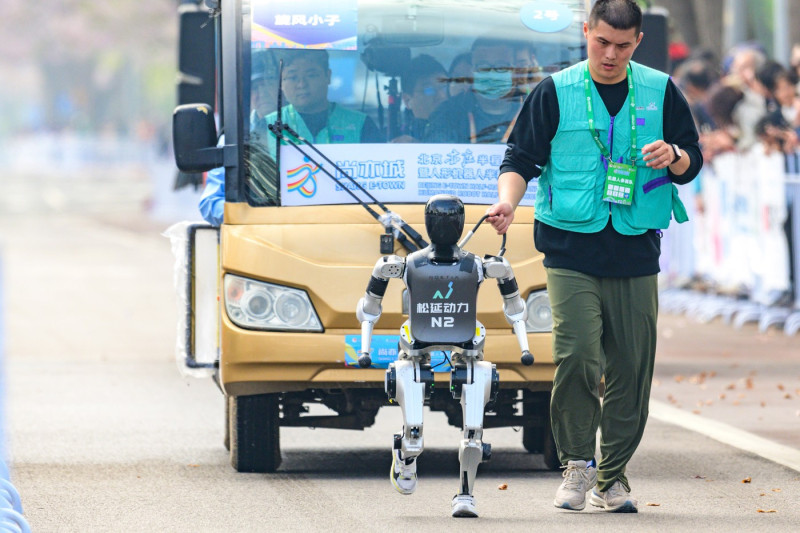 BEIJING, CHINA - APRIL 19: A N2 humanoid robot developed by Noetix Robotics competes in the Beijing E-town Half-Marathon