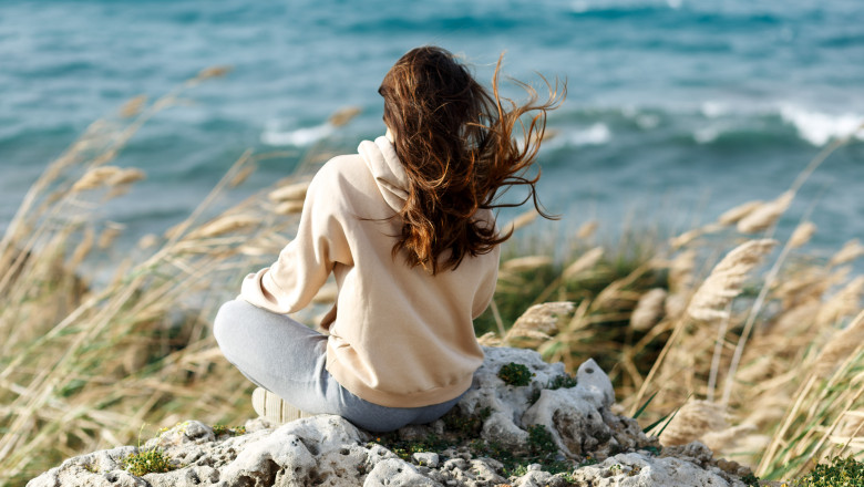 Young,Yoga,Woman,Meditation,,Mindfulness,On,Seaside,Rock,Cliff,Edge.