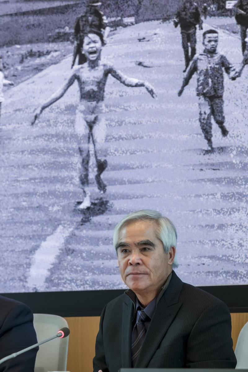 Italy, Milan: From Hell to Hollywood, photo exhibition by Nick Ut at Palazzo Lombardia. Photographer Nick Ut poses in front of his famous photo 1973 Pulitzer Prize winning photo 'Napalm girl'