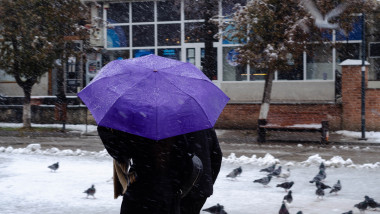 Cold,Weather.,Unidentified,People,Walk,On,The,Street,In,Botosani,