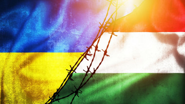 Grunge flags of Ukraine and Hungary divided by barb wire illustration sun haze view