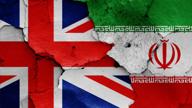 flags of UK and Iran