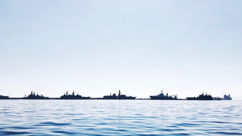 Boats Sailing In Sea Against Clear Sky