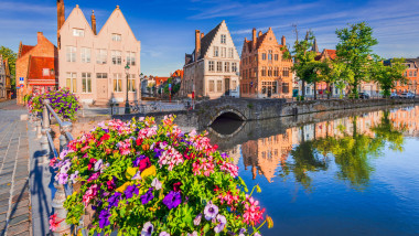 Bruges, Belgium. Beautiful sunrise on Spiegelrei Canal, famous Brugge place.