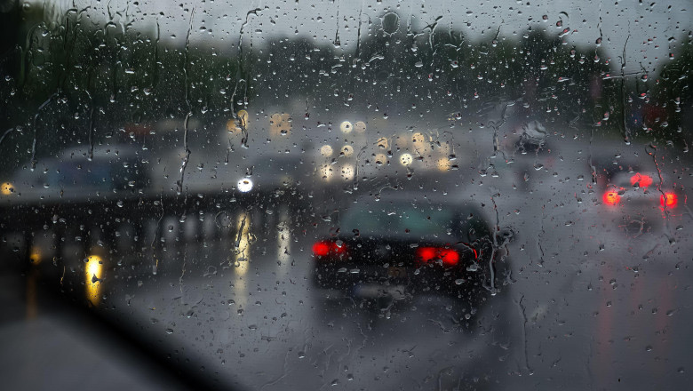 Otopeni, Romania - June 17, 2020: Cars run in the rain on a low visibility segment of the European route E60 in Otopeni.
