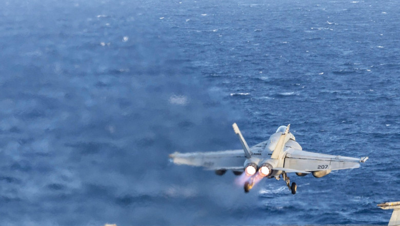 USS Harry S Truman, International Waters. 01 April, 2025. A U.S. Navy F/A-18E Super Hornet fighter aircraft from the Pukin' Dogs of Strike Fighter Squadron 143, launches from the flight deck of the Nimitz-class aircraft carrier USS Harry S. Truman underwa