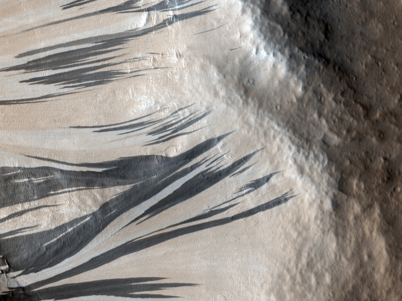 dark streaks, also known as "slope streaks," in an area of Mars called Acheron Fossae