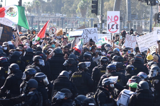 LOS ANGELES, CALIFORNIA - JUNE 08: Protesters confront police following recent raids by Immigration and Customs Enforcem