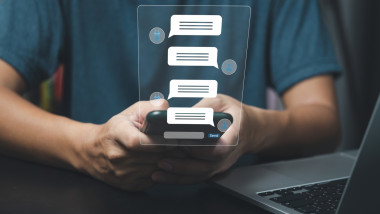 AI Chatbot service smart digital customer service.Artificial intelligence and service automation technology concept.man chatting with chatbot via application with speech bubble on virtual screen.