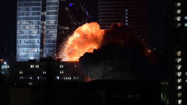 A building is hit by a missile in Tel Aviv, Israel, on June 13, 2025.