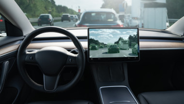 Self,Driving,Car,On,A,Road.,Autonomous,Vehicle.,Inside,View.