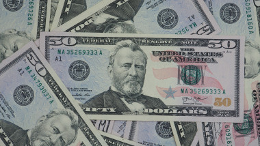 Pile,Of,New,Design,Us,Dollar,Bills,As,Background.