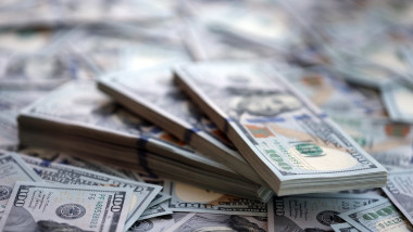 Very big amount of US hundred dollar bills. Huge quantity of united states currency notes on flat table