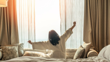 Hotel,Relaxation,On,Lazy,Day,With,Asian,Woman,Waking,Up