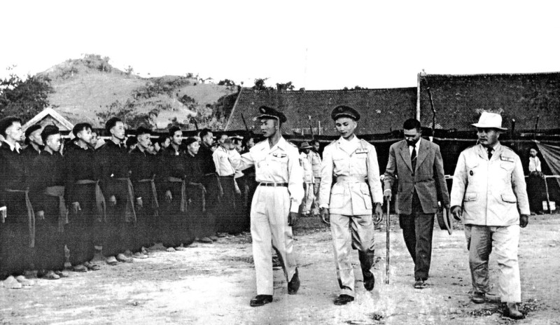 Laos: General Vang Pao (left) reviews Hmong forces with Touby Lyfoung, Hmong politician and leader (right), during the First Indochina War, c. 1954