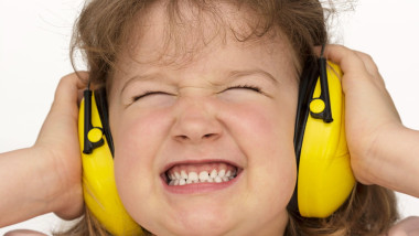 Noise sucks! Child wears hearing protection