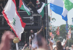 Previously unissued photo dated 28/6/2025 of Bob Vylan stands amongst the crowd holding the flag of Palestine, during his performance on the West Holts Stage, during the Glastonbury Festival at Worthy Farm in Somerset. Glastonbury Festival has said it is