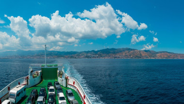 View of the Messina sea strait and coastline from the side of the ferry to Sicily island, Italy.
