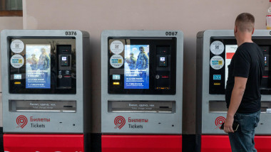 Moscow, Russia. 7th of September, 2024. A man buys metro ticket from a machine, on the screen of which there is an advertisement for service in the Russian army under contract, in Moscow, Russia