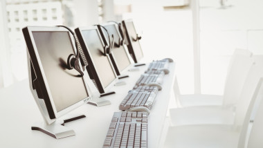 Call center computers and headsets